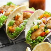 Sonora Shrimp Tacos · Two tasted tacos perfectly filled with sea fresh shrimp, lettuce, tomatoes, our special Sono...