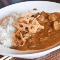 Mushroom Curry · Sauteed brown mushrooms in a mildly spicy curry. Served hot over rice and topped with fried ...