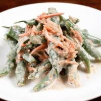 Green Bean Salad · Crunchy green beans and organic shredded carrots in a traditional creamy sesame dressing.