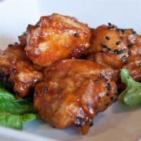 Sweet and Spicy Chicken · All natural chicken marinated in sake and kiwi, lightly fried then tossed in our sweet and s...