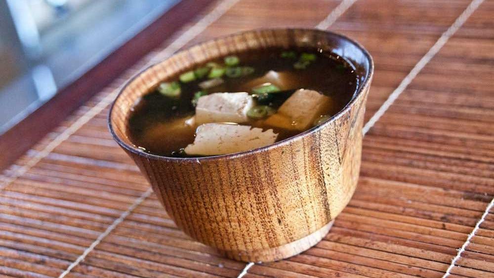 Organic Tofu Miso Soup · Miso soup with bonito dashi, organic tofu, wakame seaweed, and green onion.