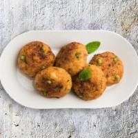 Golden Potato Medallions · Gently spiced mashed potato mixed with finely chopped cilantro flattened into medallions and...