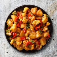 Calm Cauli Potato · Potato and cauliflower pieces cooked to perfection with chopped onions, tomatoes, green chil...