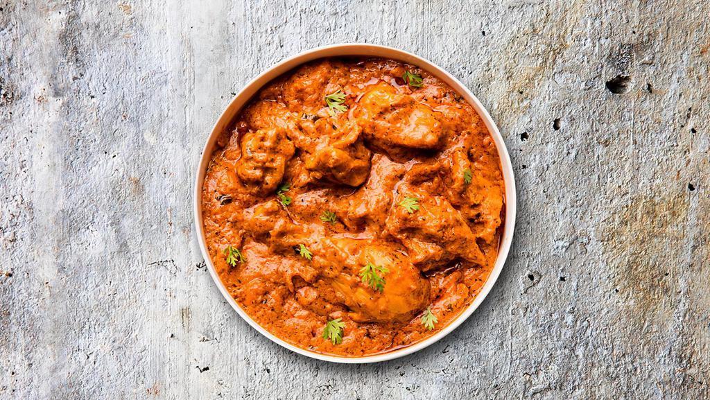 Classic Chicken Tikka Masala · Chicken pieces roasted in a clay oven and tossed in a creamy tomato sauce.