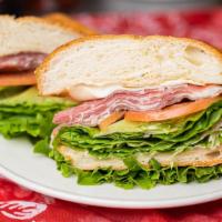 Prosciutto Sandwich · Includes mustard, mayonnaise, lettuce, tomato, pickles, onions, peperoncino, jalapeno, oil, ...