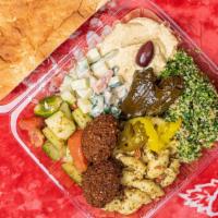 Mediterranean Plate · Includes falafel, dolmas, tabbouleh salad, hummus, tahini salad, tomato and cucumber salad, ...