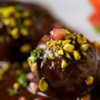 Pistachio Meatballs · Beef meatballs in pinot noir pomegranate sauce.