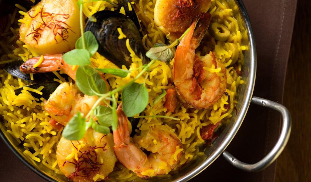 Seafood Paella · Saffron rice, prawns, jumbo scallops, mussels, chicken chorizo.
