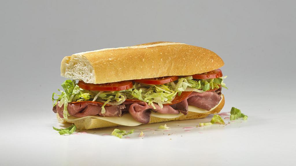 #12 Cancro Special · All natural oven roasted top rounds and provolone, perfectly complemented with a layer of pepperoni. Served Mike's Way with onions, lettuce, tomato, vinegar, oil, oregano, and salt.