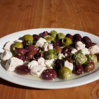 Feta & Olives · Vegetarian dish. Pasteurized cow milk feta, kalamata olives, herbs & olive oil.