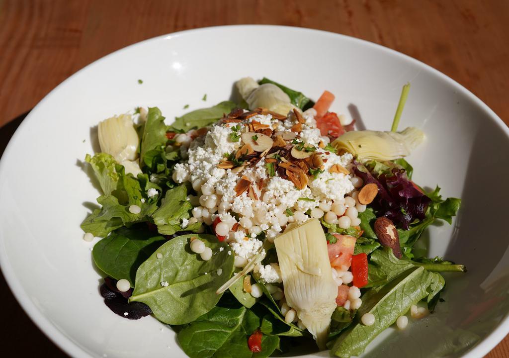 Pasha Salad · Pearl couscous, spring mix, artichoke hearts, piquillo peppers, toasted almonds, tomato, feta cheese, lemon olive oil dressing.