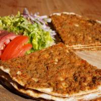 Lahmacun (Turkish Style Pizza) · Comes with 2 order. Flatbread topped with ground lamb and chopped garden vegetables.