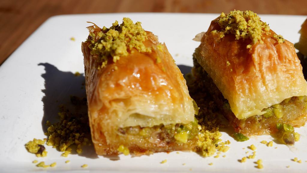 Baklava · Phyllo layers, walnuts, pistachio, and simple.