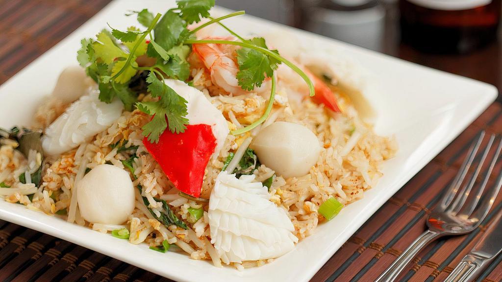 R12. Seafood Fried Rice · Shrimp, fish ball, squid, crab stick, egg, basil, onion.