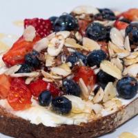 Honey Berry Toast · Toast, Cream Cheese, Sliced Strawberries, Blueberries and Almonds drizzled with Honey