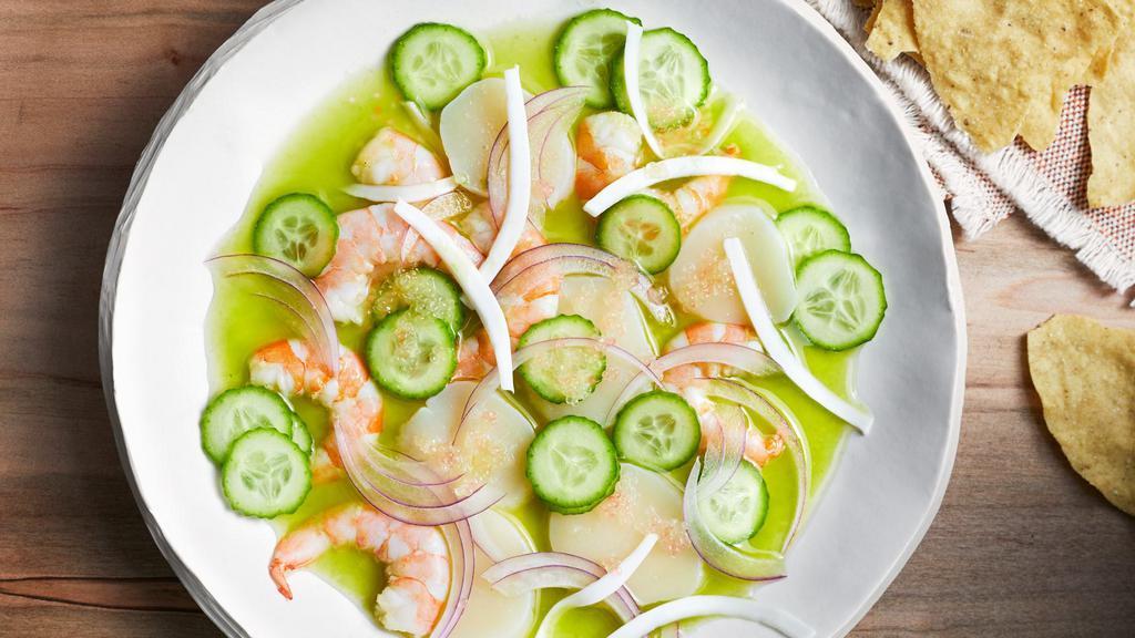 Aguachile Verde · Lime fermented shrimp, sliced onion, sliced cucumber, sliced tomato, avocado on top, sprinkled dried chilies (Very Spicy). 
Camaron curtido, cebolla, pepino, tomate, aguacate, y chile rojo en polvo.