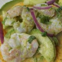 Aguachile Tostada · Lime fermented shrimp, sliced onion, sliced cucumber, sliced tomato, avocado on top, sprinkl...
