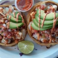 Tacos Capeados · Choice of protein, mayo, purple cabbage, pico de gallo, avocado, chipotle sauce. Mild, spicy...