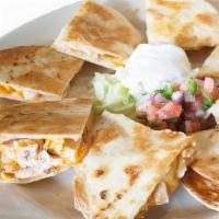 Quesadilla · Daiya cheese melted in a flour tortilla with fresh onion cilantro mix. Served with your choi...