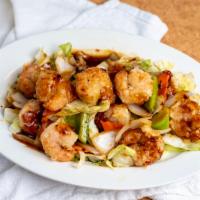 SZECHUAN FRIED PRAWNS · Flour dusted  prawns sauteed with bell peppers, onions and carrots in our spicy garlic Szech...
