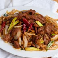 MONGOLIAN BEEF OR LAMB · Slices of beef or lamb sauteed with scallions, onions and roasted red hot peppers in our spe...