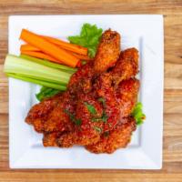 PATIO WINGS · 12 crispy wings tossed in one of our house made sauces: atomic fire (crazy hot), original, c...