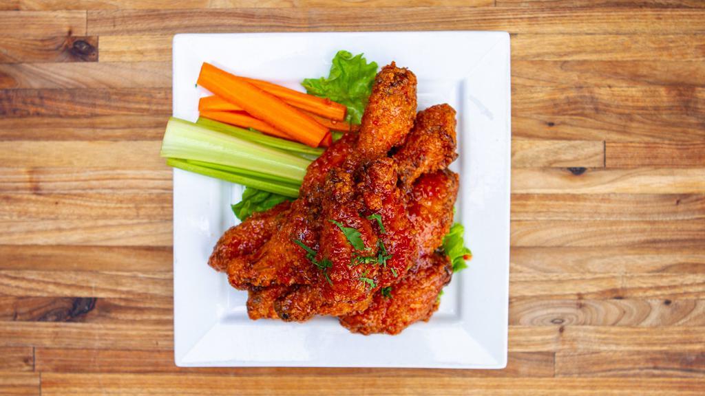 PATIO WINGS · 12 crispy wings tossed in one of our house made sauces: atomic fire (crazy hot), original, chipotle or sweet & spicy