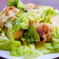 CAESAR SALAD · romaine lettuce, shaved parm, herbed croutons tossed in house made Caesar dressing