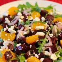 BEETS & GOAT CHEESE · roasted beets and chevre served with orange, candied walnuts, micro greens and balsamic vina...