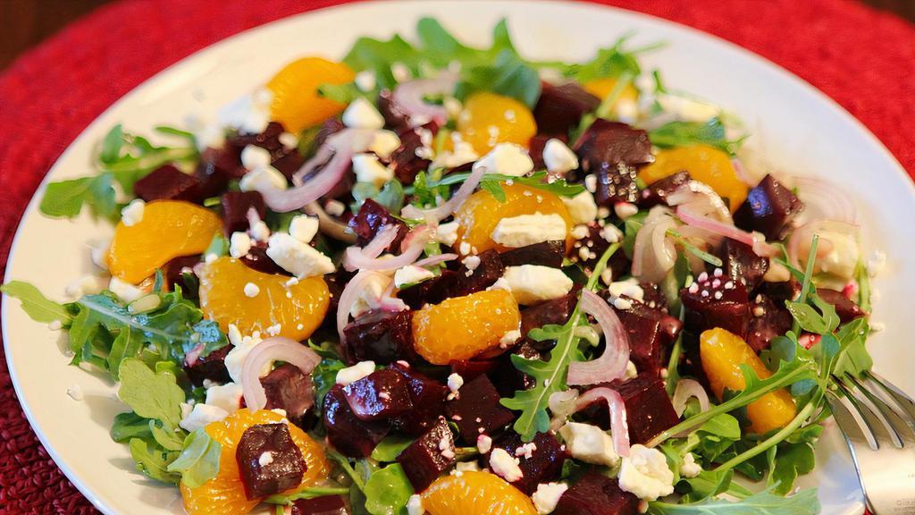 BEETS & GOAT CHEESE · roasted beets and chevre served with orange, candied walnuts, micro greens and balsamic vinaigrette