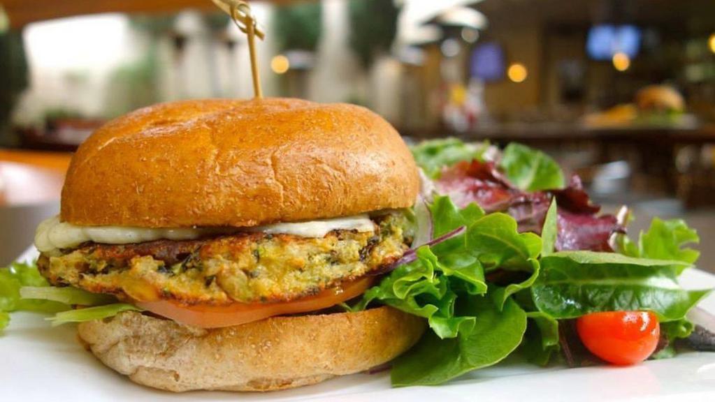 BUBBIES BURGER · house-made veggie burger with cheese, 
tomatoes, lettuce, onions and garlic aioli.