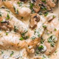 CHICKEN AND ROAST MUSHROOM FRICASSEE · pan roasted chicken breast topped with a savory white wine and tarragon mushroom cream sauce...