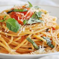 POMODORO PASTA · cappellini in a classic tomato, basil, and roasted garlic sauce, topped with fresh parmesan....