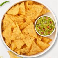 Holy Guacamole & Chips · A heaping scoop of fresh guacamole and warm tortilla chips.