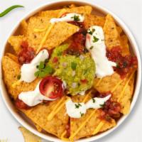 It's Nacho Problem · Warm nachos topped with salsa, guacamole, sour cream, and cheese.