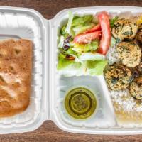 Falafel Plate · Deep-fried ball made from ground chickpeas wrapped with salad and Sahara sauce