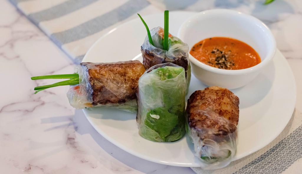 Grilled Pork Sausage Spring Roll (NEM NƯỚNG CUỐN) · Nước chấm có đậu phộng.
Grilled pork sausage wrapped in rice paper with veggie. Served with chef's special sauce (Contain peanut).