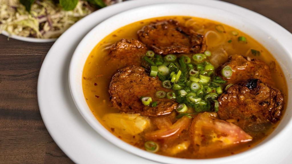 Noodle Soup with Fried Fish Cake/Crab Cake (BÚN CHẢ CÁ/CHẢ CUA) · Noodle soup with tomato and pineapple and your choice of fried fish cake or crab cake.