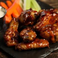 Traditional Teriyaki · 8 traditional wings tossed in teriyaki (mild heat), served with carrots & celery and a dippi...