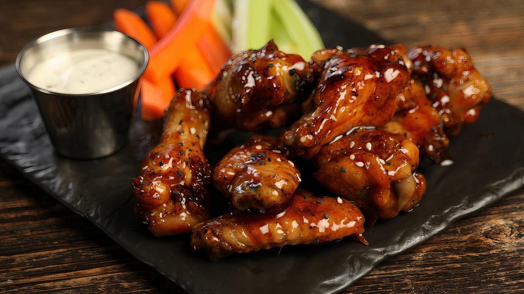 Teriyaki - 8 Wings · 8 traditional wings tossed in teriyaki (mild heat), served with carrots & celery and a dipping sauce of your choice.