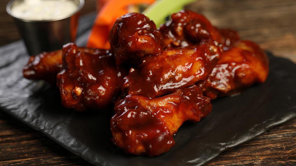 Classic Bbq- 8 Wings · 8 traditional wings tossed in BBQ (mild heat), served with carrots & celery and a dipping sauce of your choice.