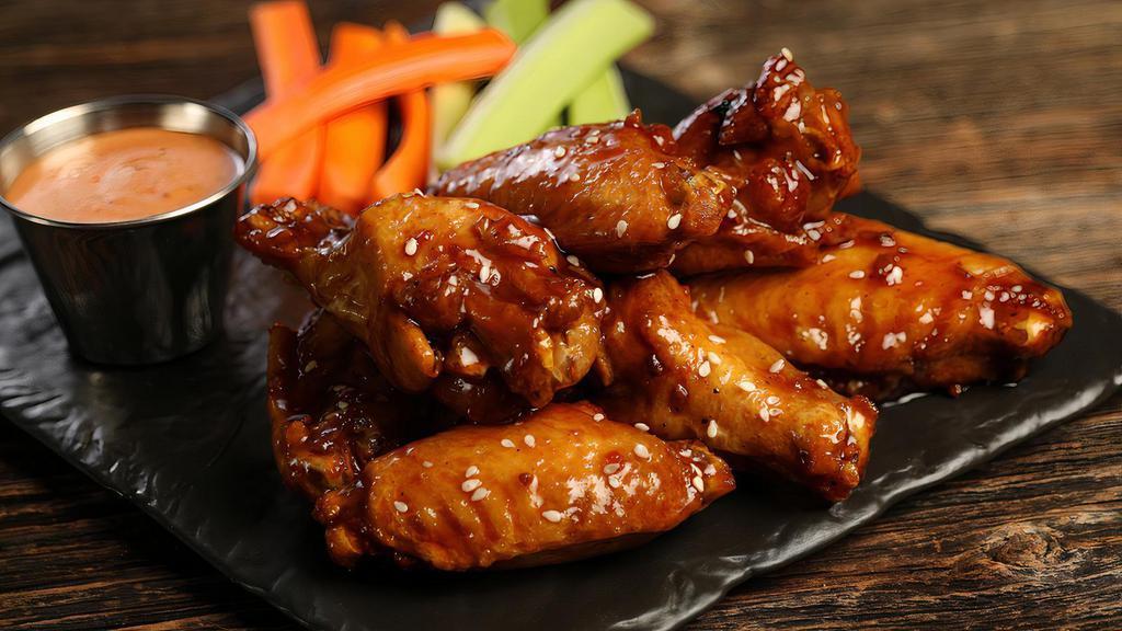 Korean Bbq - 8 Wings · 8 traditional wings tossed in Korean BBQ (mild heat), served with carrots & celery and a dipping sauce of your choice.