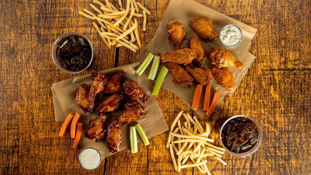 16-Count Party Pack · 16 count order of traditional wings tossed in up to 2 different flavors or naked with up to 2 different flavors on the side. Comes with 2 servings of classic fries, 2 drinks, carrots & celery, and 2 dipping sauces of your choice.