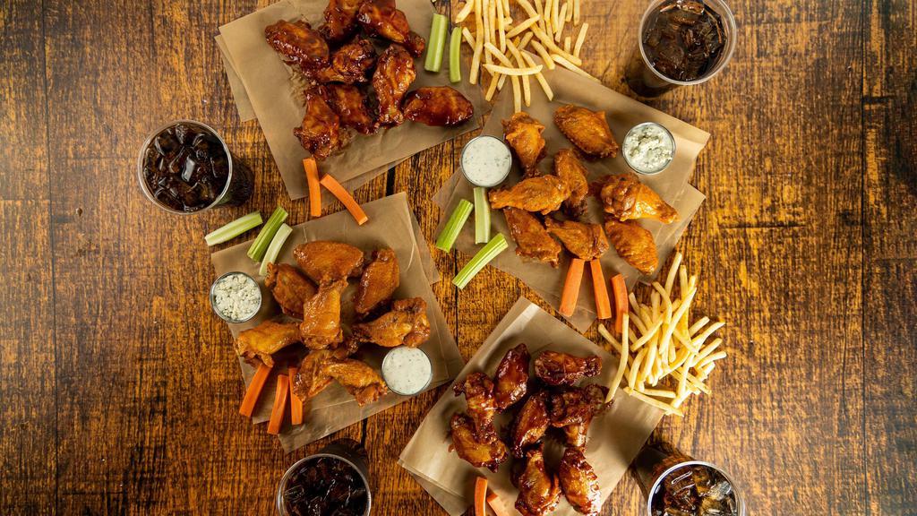 32-Count Party Pack · 32 count order of traditional wings tossed in up to 4 different flavors or naked with up to 4 different flavors on the side. Comes with 2 servings of classic fries, 2 drinks, carrots & celery, and 2 dipping sauces of your choice.