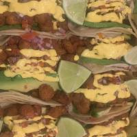 Family Fish Tacos · Serves 2 to 3. (9) Plantain crusted Tilapia tacos, salsa fresca, avocado slices, topped with...