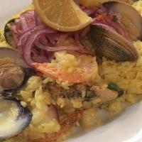 Family Jalea de Mariscos · Servers 3 to 4. Peruvian style Paella - Calamari, Scallops, Shrimp, Clams, Mussels, Crab Cla...