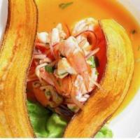Ceviche Mango · Prawns marinated in mango puree, rocoto, cilantro, and lime; served with plantain chips.