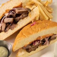 Pan con Chicharon · Peruvian deep fried pork, sweet potato. Served with choice of house-cut fries or salad