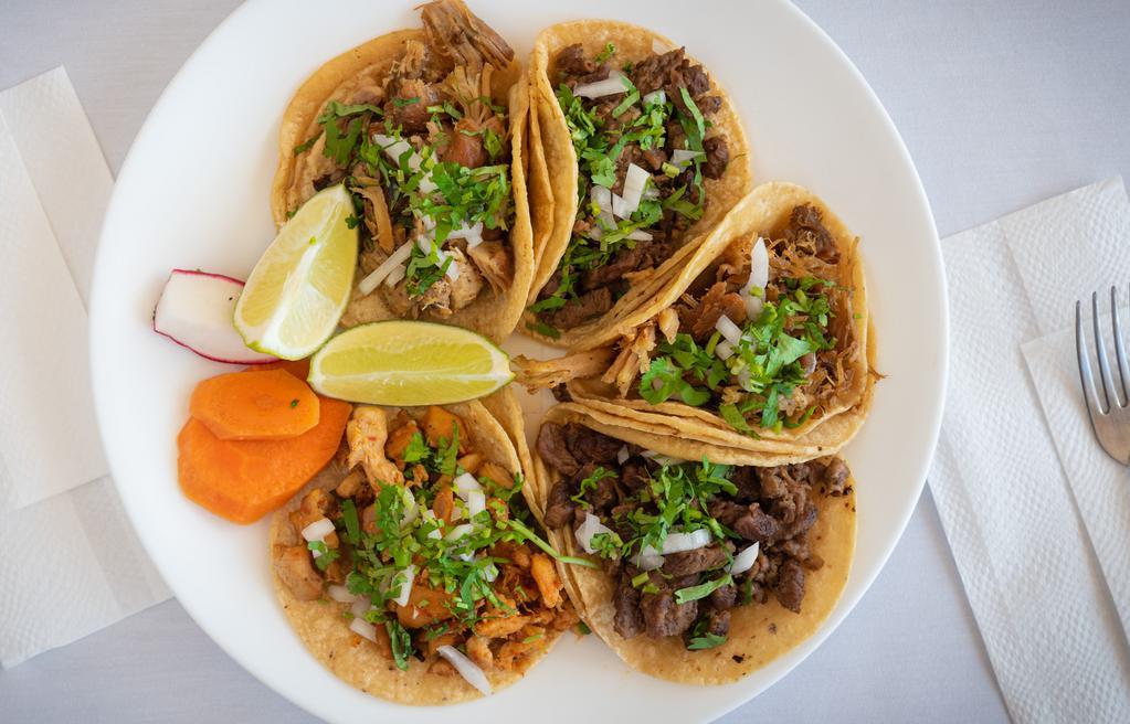 Regular Taco · Choice of meat, onion, cilantro, and salsa served on a corn tortilla.