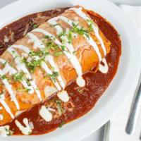 Wet Burrito · Burrito drenched in enchilada sauce and melted cheese.